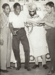 (L to R) Eddie Holland, Marv Johnson, Al Abrams, Berry Gordy in an early Tamla promotion