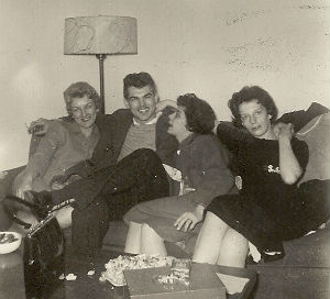 The Higgins' apartment: (L to R) Sandy Short, her friend Jim, Pat Higgins, and Ruth Ann Carr