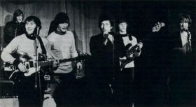 (L to R) Clarke, Crosby, Clark, Dylan, Hillman, and McGuinn on stage at Ciro's